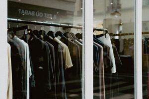 Commercial garment display featuring premium plastic hangers for apparel brands