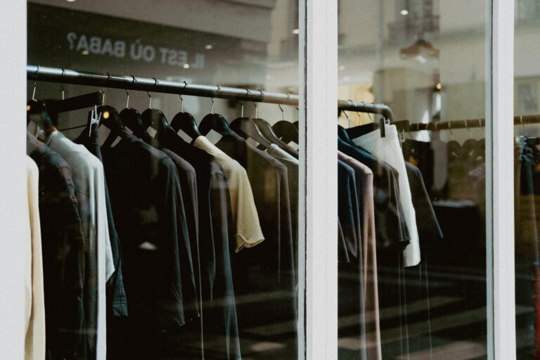 Commercial garment display featuring premium plastic hangers for apparel brands