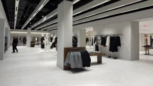 Modern apparel retail store interior featuring bulk custom plastic hangers
