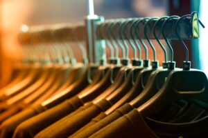 Clothing rack with hanging garments in an apparel boutique