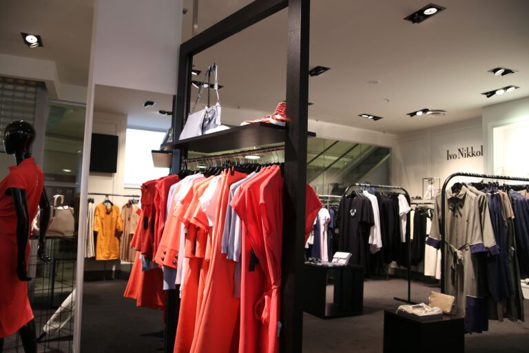 Clothing store display with garments on hangers