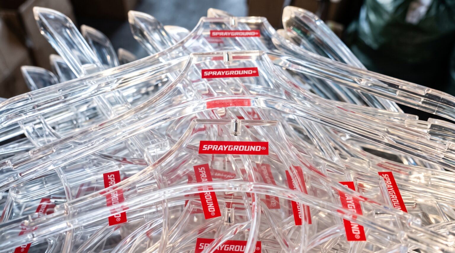 Clear plastic clothes hanger with custom logo